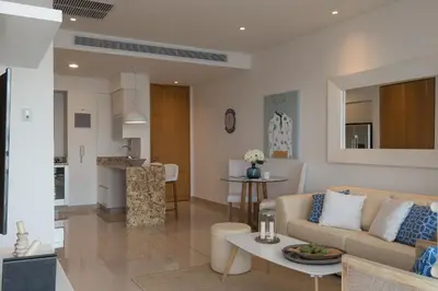 a living room with a couch and a table at Classy 1 BR, Pool, Gym near Downtown Cartagena by Huespedia in Cartagena de Indias