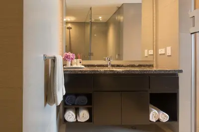 a bathroom with a sink and a large mirror at Classy 1 BR, Pool, Gym near Downtown Cartagena by Huespedia in Cartagena de Indias