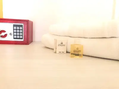 a room with a clock and two candles on a table at Hotel Balcones de Bocagrande in Cartagena de Indias