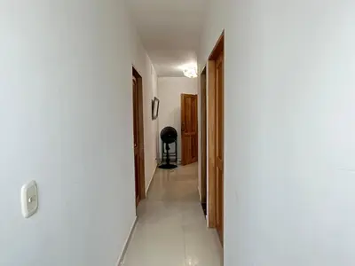 a hallway with white walls and a white floor at Apartamento la Isla 1-Coveñas in Coveñas
