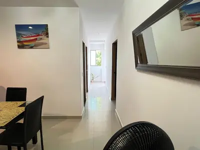 a dining room with a table and chairs at Apartamento la Isla 1-Coveñas in Coveñas