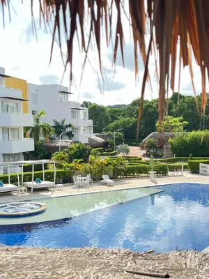 a swimming pool in front of a building at Santo Manglar Cartagena Life Wellness Spa Hotel in Cartagena de Indias