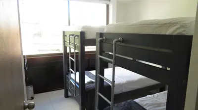 two bunk beds in a room with a window at SAN JACINTO HOSTEL in Cartagena de Indias