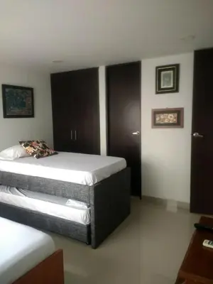 a bedroom with two beds in a room at 1C5 APARTAMENTO EN CARTAGENA CON BALCON Y VISTA AL MAR, AIRE ACONDICIONADO Y WIFi in Cartagena de Indias