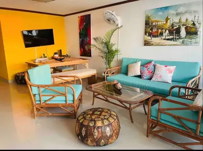 a living room with a couch and chairs and a table at IV 2 bedroom apartment in Cartagena de Indias