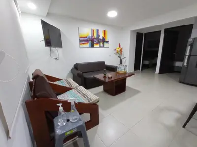 a living room with a couch and a table at APTO INTERIOR in Cartagena de Indias