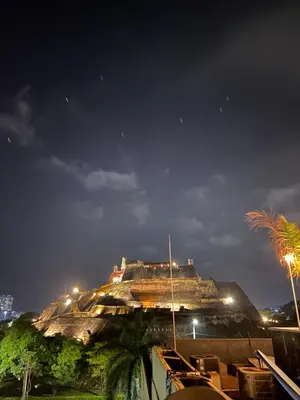 a building on top of a mountain at night at Hotel Blue Diamond House in Cartagena de Indias