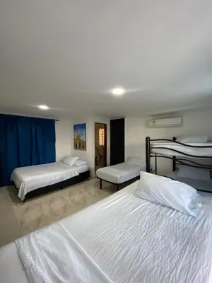 a hotel room with two beds and two bedsvisor at Hotel Blue Diamond House in Cartagena de Indias