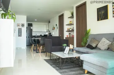 a living room with a couch and a table at Brand New - Prime Location For All Budgets - Executive & Luxury in Barranquilla