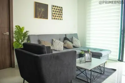 a living room with a couch and a coffee table at Brand New - Prime Location For All Budgets - Executive & Luxury in Barranquilla