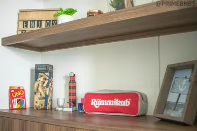 a shelf with a red box on top of it at Brand New - Prime Location For All Budgets - Executive & Luxury in Barranquilla