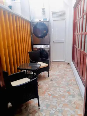 a room with a table and chairs and a tv at CASA PACHITA Getsemani in Cartagena de Indias