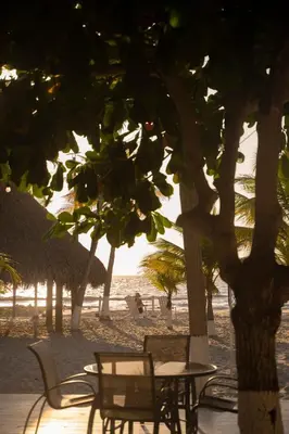 a group of chairs and tables on a beach at Quinta del Mar La Joya in Tolú