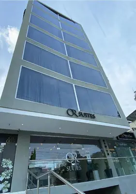 a tall building with a lot of windows at Hotel OR Suites in Barranquilla