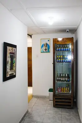 a room with a refrigerator filled with drinks at Hotel Poblado Suite in Barranquilla
