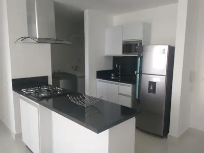 a kitchen with a refrigerator and a counter top at Playa Bello Horizonte, vista preciosa in Gaira
