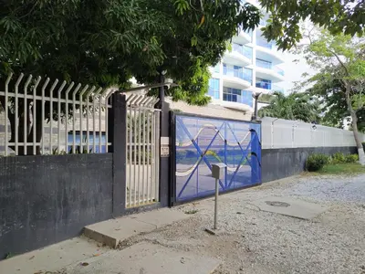 a fence with a gate with a parking meter at Playa Bello Horizonte, vista preciosa in Gaira