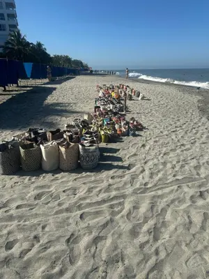 a row of baskets on a sandy beach at Playa Bello Horizonte, vista preciosa in Gaira
