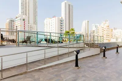 a balcony with a view of a city with buildings at Cómodo moderno apto en Bocagrande a 2' de la playa in Cartagena de Indias