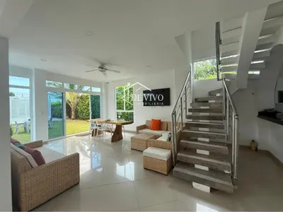 a living room with a staircase in a house at VILLA MANDALAY in Santa Veronica