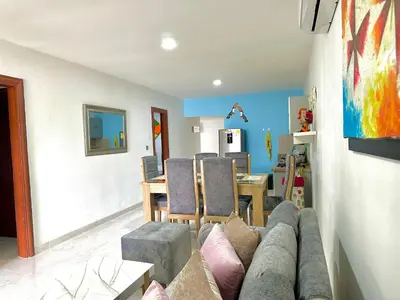 a living room with a couch and a table at Apartamento en Coveñas cómodo y acogedor in Coveñas