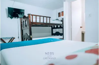 a bedroom with a bed and a bunk room with a bunk bed at Neos Hotel Cartagena in Cartagena de Indias