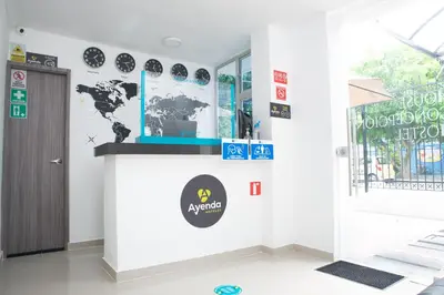 a room with a world map on the wall at Hotel Ayenda House Concepción 1317 in Barranquilla