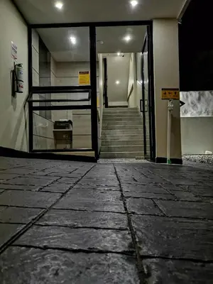 an entrance to a building with a door and stairs at Berilo Deluxe Apartahotel in Barranquilla