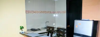 a kitchen with a sink and a refrigerator at Loft sea view 19C air and wifi in Cartagena de Indias