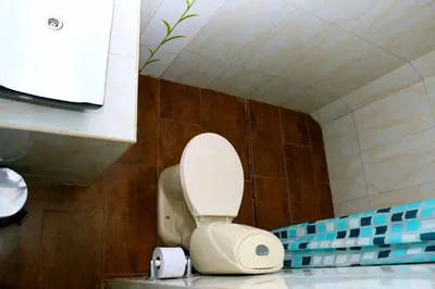 a bathroom with a white toilet in a room at Sea View Apartment 1-19C Air Wifi in Cartagena de Indias