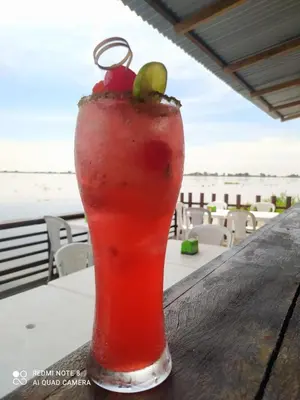 a drink sitting on top of a table at Hotel Campestre Maguey in Mangue