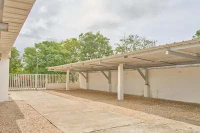 an empty garage with awning on top of it at Mágico Apartamento Frente al Mar 3 Habitaciones PV21 in Coveñitas