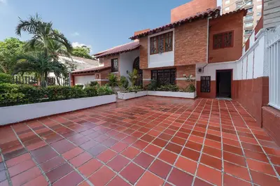 a brick driveway in front of a house at Villa Santos Apartaestudios in Barranquilla