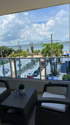 a balcony with a view of a beach and the ocean at A un Paso de la Playa in Cartagena de Indias