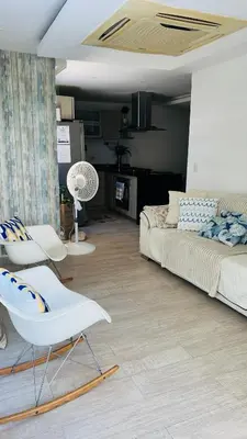 a living room with a couch and chairs in it at A un Paso de la Playa in Cartagena de Indias