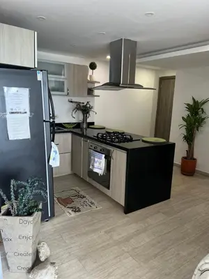 a kitchen with a stove and a counter top at A un Paso de la Playa in Cartagena de Indias