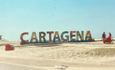 a large sign in the sand on a beach at Cartagena Escape Plaza in Cartagena de Indias