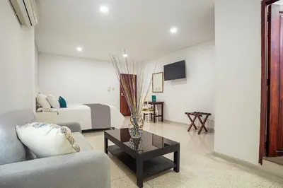 a living room with a couch and a table at Ayenda Hotel Carivdi in Sincelejo