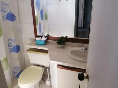 a bathroom with a toilet and a sink at Apartahotel Isla Fuerte Piso 4 in Cartagena de Indias