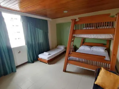 a bedroom with two bunk beds and a window at Apartahotel Isla Fuerte Piso 4 in Cartagena de Indias