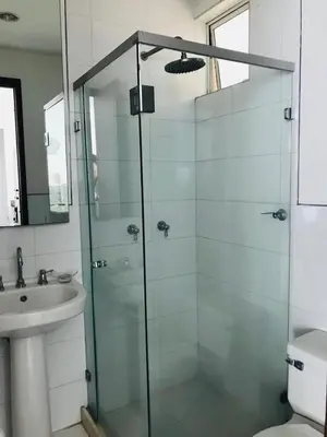 a bathroom with a glass shower and a sink at Morros 922 una alcoba Edificio frente al mar in Cartagena de Indias