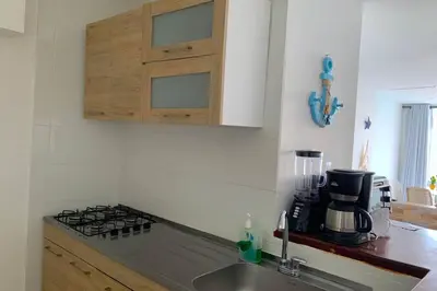 a kitchen with a sink and a stove top oven at Apartamento cerca de playas y zonas turísticas in Cartagena de Indias