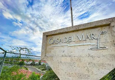 a sign that says casa del war on a wall at Casa de Playa in Cartagena de Indias