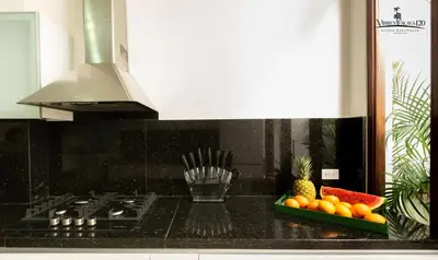 a kitchen with a counter top with fruit on the counter at Virrey Eslava 120 Luxury Guesthouse in Cartagena de Indias