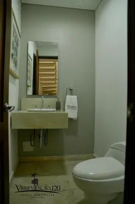 a bathroom with a toilet and a sink at Virrey Eslava 120 Luxury Guesthouse in Cartagena de Indias