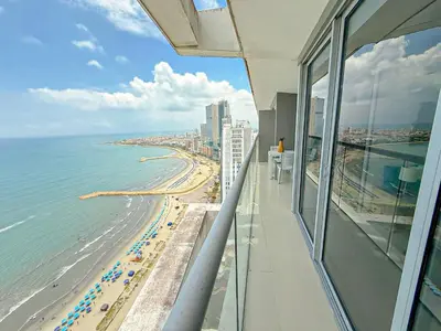 a view of the beach from a balcony of a building at 31st Perfect Seaview Bocagrande Morros City in Cartagena de Indias