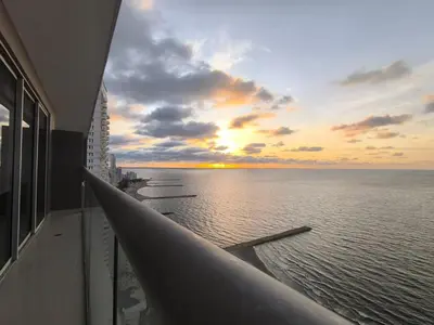 a view of the ocean at sunset from a building at Apartamentos frente al mar en Morros City in Cartagena de Indias