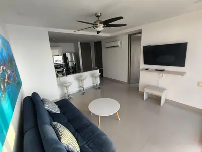 a living room with a couch and a table at Apartamentos frente al mar en Morros City in Cartagena de Indias