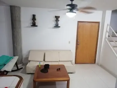 a living room with a couch and a table at Casa, playa Bello Horizonte Santa Marta Colombia in Santa Marta