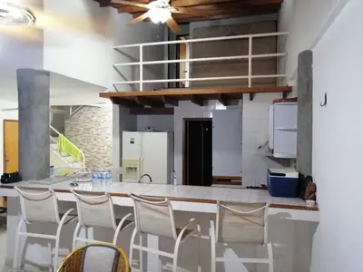 a kitchen with a table and chairs in a room at Casa, playa Bello Horizonte Santa Marta Colombia in Santa Marta
